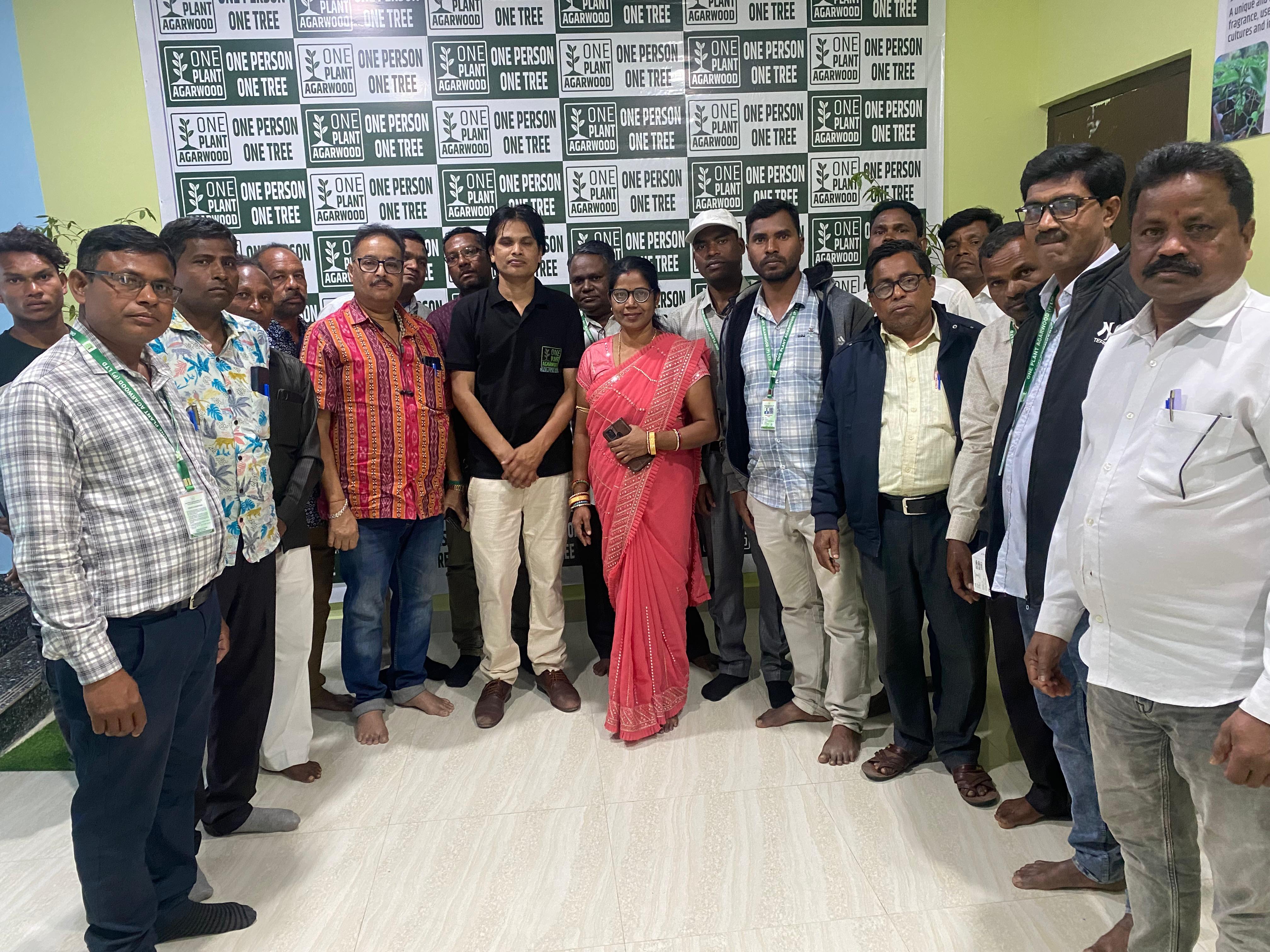 Farmer planting agarwood saplings